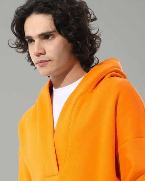 An orange hoodie with a modern cut from Defect